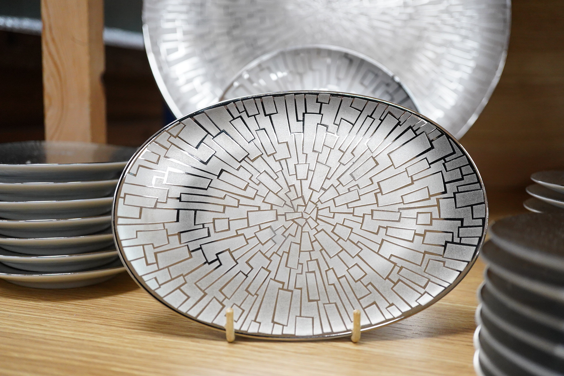A collection of Rosenthal studio line TAC Gropius Skin platinum dinnerware, largest 33cm in diameter